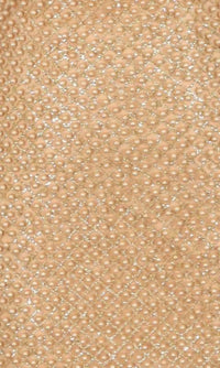 Close up of a champagne colored dress fabric with pearl embellishments.