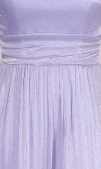 Close-up of a light purple dress with rhinestone embellishments