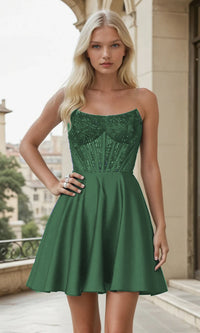 Woman wearing a strapless short green dress with a textured bodice in an urban setting