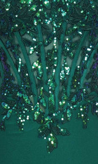 Close-up of emerald green fabric with sheer and sequin detailing.