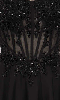 Close-up of a black dress with intricate beadwork and sheer panels