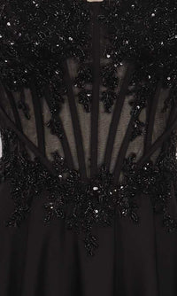 Close-up of a black dress with intricate beadwork and sheer panels