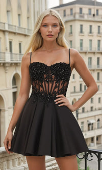 Woman wearing a black dress with intricate detailing in an urban setting