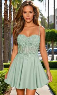 Woman wearing a light green dress with lace details in an outdoor setting.
