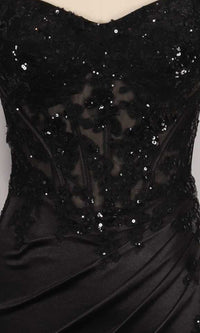 Close-up of a black dress with sequin detailing on a sheer corset bodice.