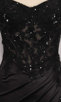 Close-up of a black dress with sequin detailing on a sheer corset bodice.