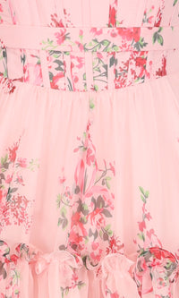 Close-up of a pink floral dress with ruffled details.