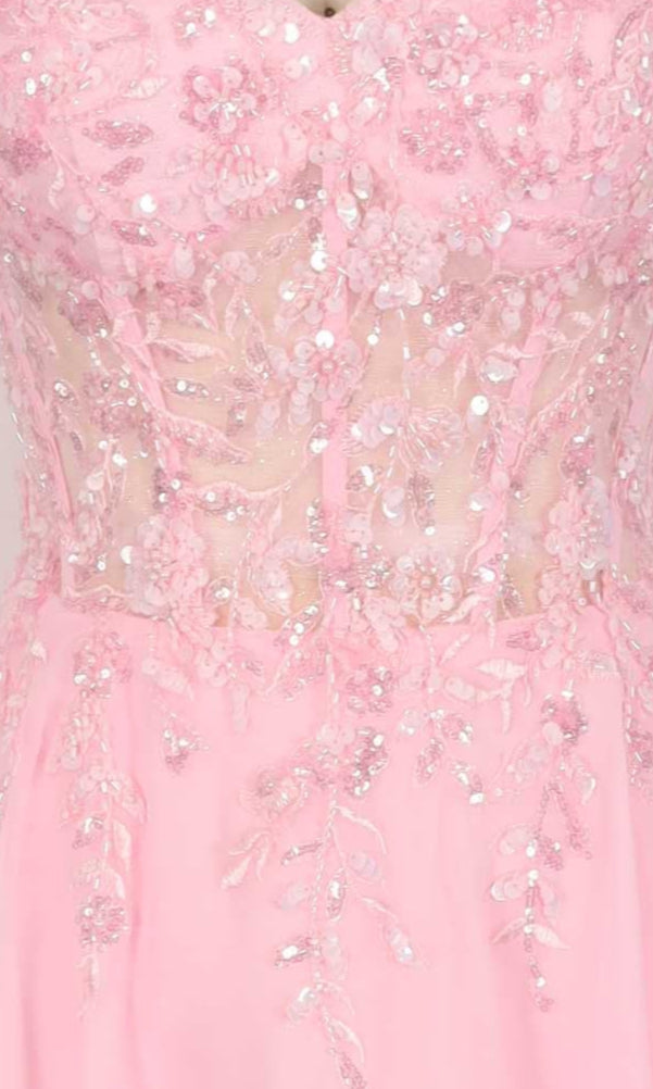 Close-up of a pink dress with sequin detailing