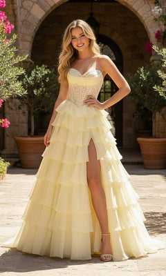 A woman stands outdoors before stone arches wearing the PromGirl Exclusive 250205 long prom dress, featuring a strapless sweetheart neckline, corset bodice, ruffled skirt, and high leg slit.
