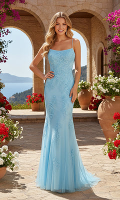 A woman wearing the Long Prom Dress: PromGirl Exclusive 250226, a light blue lace gown, stands outdoors among flowers and terracotta pots, with stone arches and a sea view in the background.