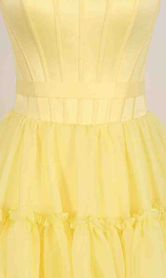 Close-up of the PromGirl Exclusive 250240B long prom dress, a light yellow strapless gown with a structured bodice featuring vertical seams and a gathered, ruffled skirt.