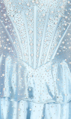 Close-up of the PromGirl Exclusive 250347 short homecoming dress in light blue satin, detailed with pearl embellishments, rhinestones, structured panels, and a ruffled waistband.