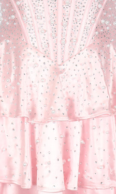 Close-up of the PromGirl Exclusive 250347 short homecoming dress, a light pink fit-and-flare style with satin-like layered fabric and small pearl embellishments.