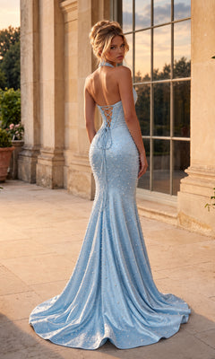 A light blue, floor-length, pearl-embellished Halter Corset Sparkly Prom Dress: PromGirl 250371 with a halter neckline, lace-up back, and flared train.
