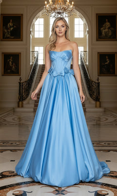 Wearing the Long Prom Dress: Poly USA 25058, a woman in a strapless satin gown with a sleek corset bodice stands in an ornate foyer with marble floors, a chandelier, and a grand staircase behind her.