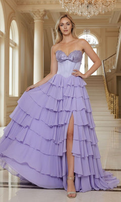 A woman poses indoors before a grand staircase and large windows, wearing the Poly USA 25074 long prom dress in lavender, featuring ruffled chiffon layers, a strapless neckline, and a high slit.