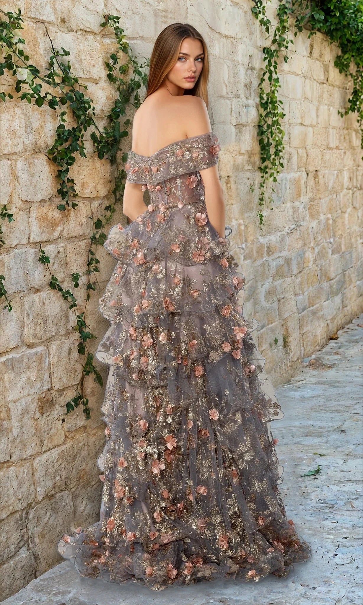 A woman in the Stella Couture 25142 long prom dress, featuring off-the-shoulder design, floor-length layered ruffles, and gold and peach floral embellishments.