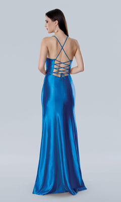 Woman wearing the Stella Couture 25211, a shiny blue satin long prom dress featuring an open back, crisscross lace-up straps, standing and facing away against a plain background.