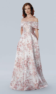 A woman stands against a plain light gray background wearing the Stella Couture 25303 long formal dress in rose, featuring an off-the-shoulder neckline and floor-length floral jacquard fabric.