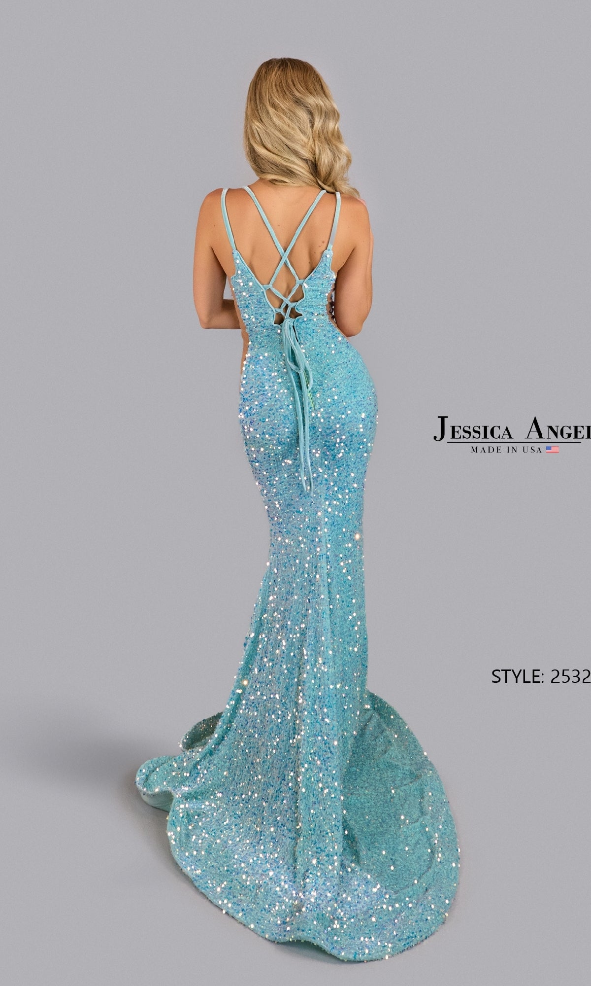 A woman with long blonde hair models the Jessica Angel 2532 Velvet Sequin Long Prom Dress, in sparkling light blue with crisscross straps and a mermaid silhouette, against a plain gray background.