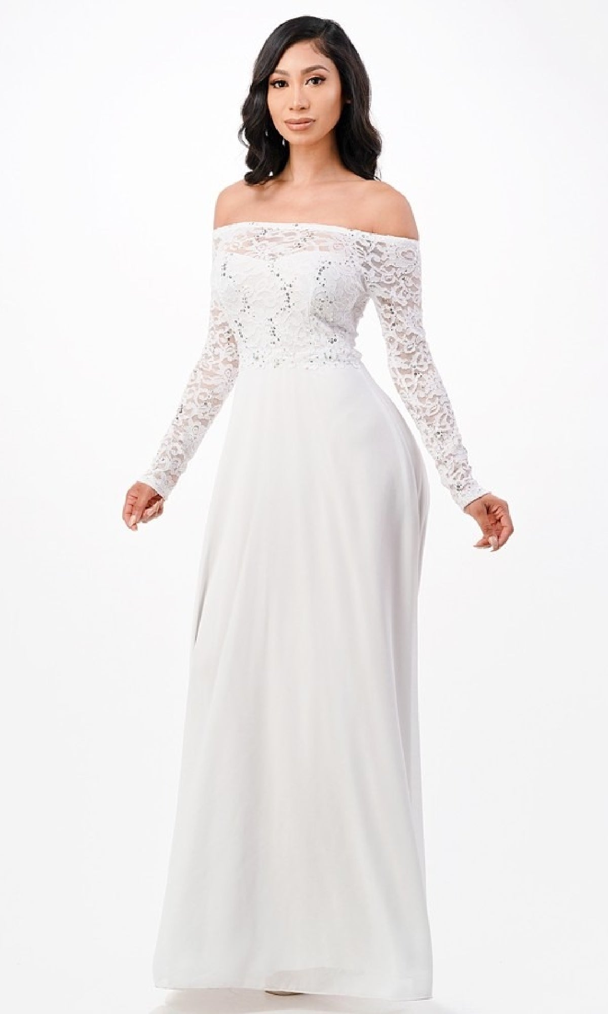 A woman wears the Long A-Line Lace-Bodice Plus-Size Formal Dress—a white, off-the-shoulder gown with elegant lace bodice and sleeves, and a flowing a-line skirt—standing against a plain white background.