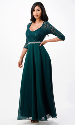 A woman models the Plus-Size A-Line Long Formal Dress with Sleeves—floor-length, dark green, featuring lace sleeves, a scoop neckline, an a-line skirt, and a beaded waistband—against a plain white background.