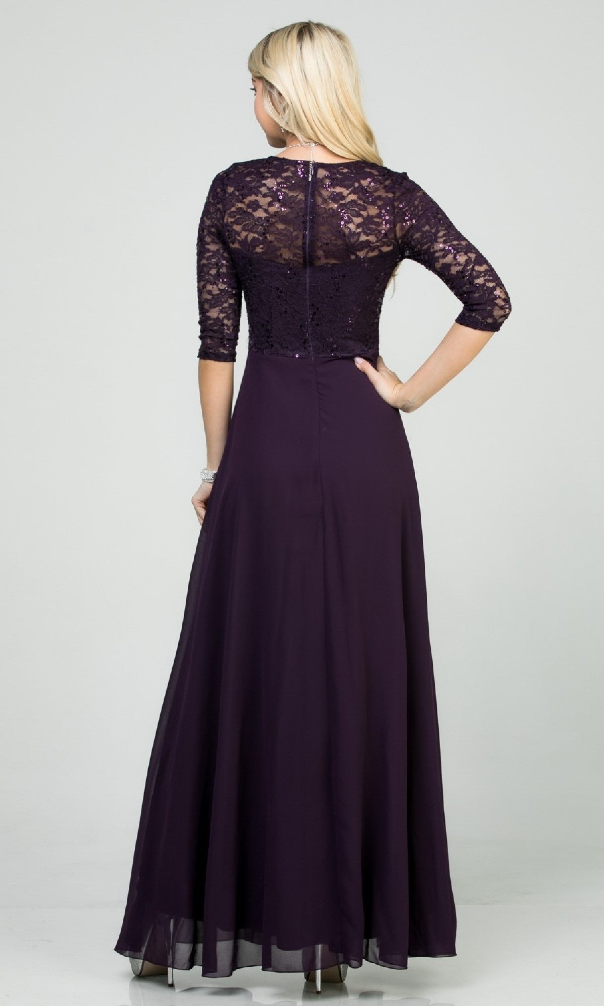 Woman in a Plus-Size A-Line Long Formal Dress with sleeves, featuring a floor-length dark purple skirt, v-neck lace bodice, and three-quarter sleeves, shown from the back.