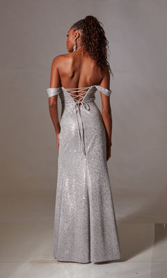 A woman faces away, modeling the Aerie Couture 254 Lace-Up Long Sequin Prom Dress—a sparkling silver off-the-shoulder gown with a lace-up back and floor-length skirt—set against a plain background.
