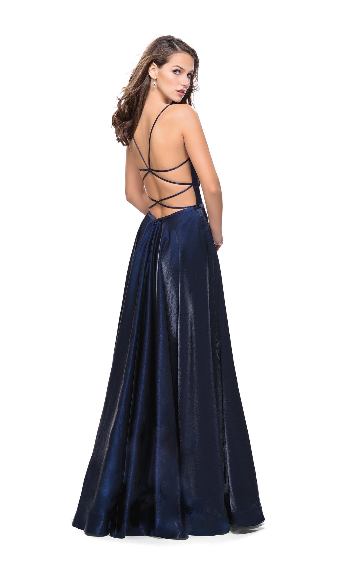 A woman poses against a white background in the La Femme 25670 Long Prom Dress—a dark blue A-line formal gown with a low, open back and elegant crisscross straps.