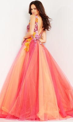 A woman in the Jovani V-Neck Long Orange Prom Ball Gown 25800 stands against a plain background, looking over her shoulder. The gown features a sleeveless, backless design with embroidered floral details in pink and orange hues.