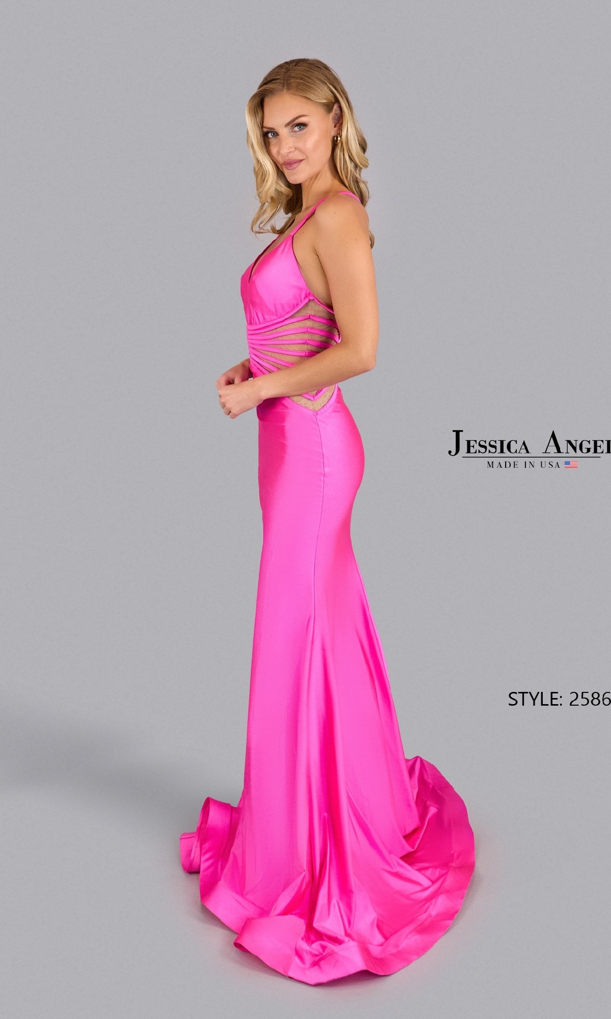Woman poses against a plain grey background in a bright pink, floor-length Open-Back Sheer Long Prom Dress: Jessica Angel 2586. Text reads 