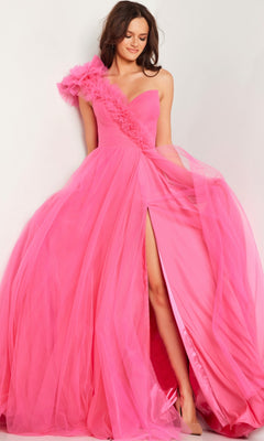 A woman models the Jovani 25919 One-Shoulder Long Prom Ball Gown in bright pink, featuring a ruffled strap and high slit, against a light background.