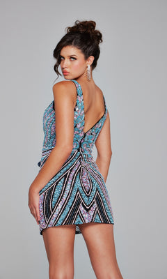 A woman wearing the Jovani Short Beaded V-Neck Homecoming Dress 25925, featuring a fitted silhouette and eye-catching sequin pattern, stands facing backward and looks over her shoulder against a plain gray background.