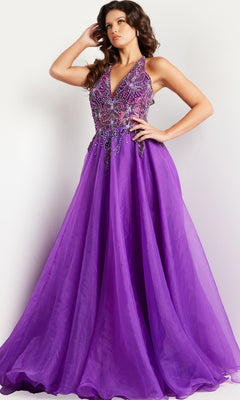 A woman poses in the Jovani Long Organza Halter Prom Ball Gown 25964, featuring a fitted embellished bodice and a flowing floor-length skirt.