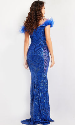 A woman with long curly hair is seen from the back wearing the Jovani Feathered Long Sequin Prom Dress 26041, a fitted, floor-length blue gown featuring sequin embellishments and feathered off-shoulder sleeves.