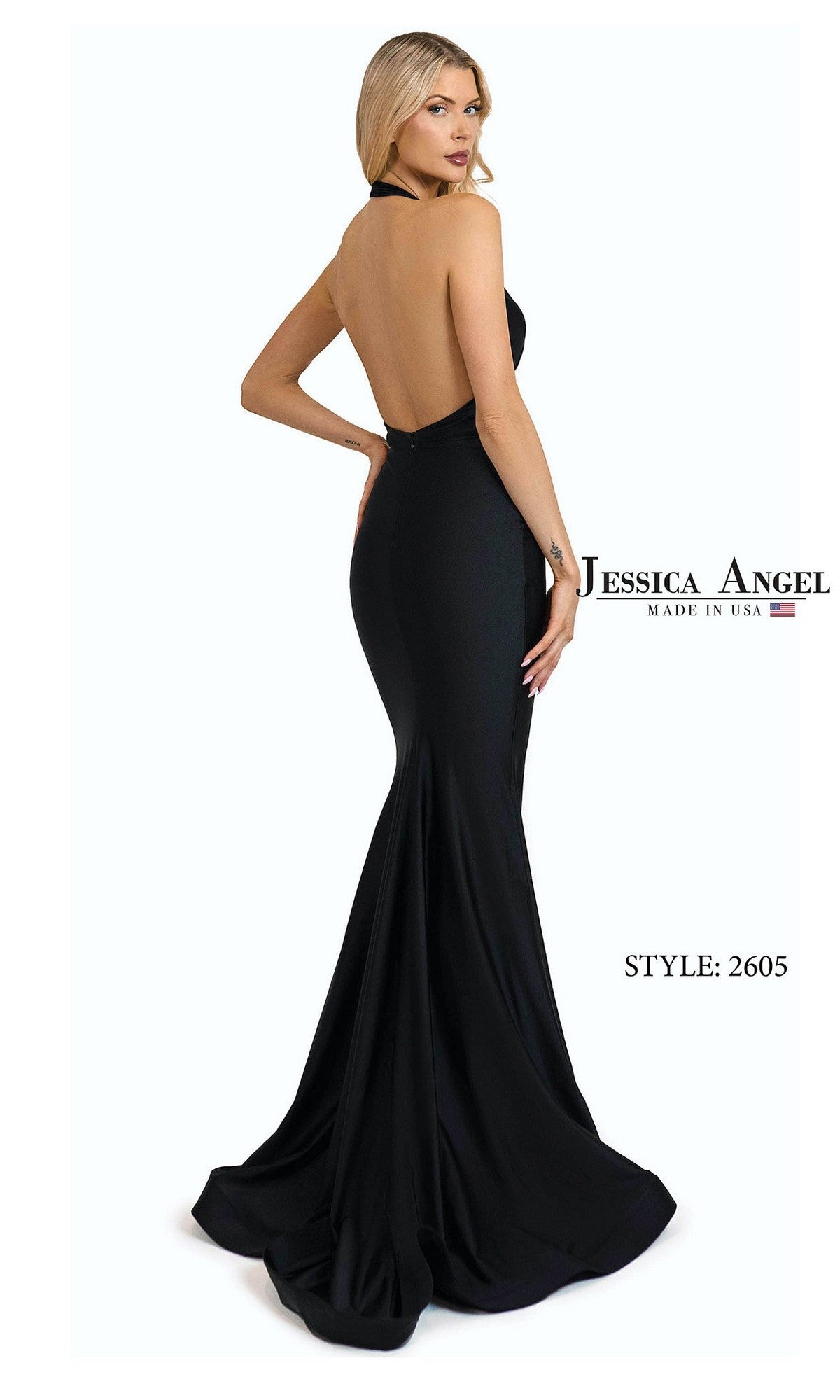 A woman poses in the Jessica Angel 2605 long prom dress—a backless, floor-length black stretch jersey halter with a fitted mermaid silhouette. Text reads 