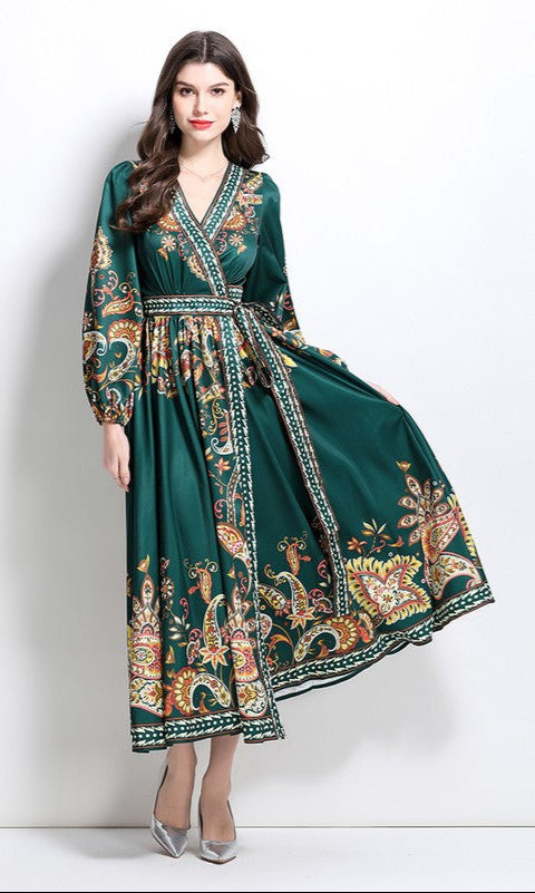 Woman wearing a forest green A-Line Long-Sleeve Print Casual Maxi Wrap Dress, posing against a plain white background.
