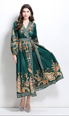 Woman wearing a forest green A-Line Long-Sleeve Print Casual Maxi Wrap Dress, posing against a plain white background.
