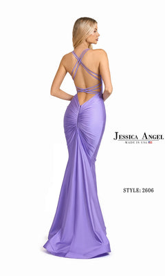 Woman in a floor-length, body-skimming lavender Jessica Angel 2606 prom dress with crisscross straps and ruched details, shown from behind. Text: "Long Prom Dress: Jessica Angel 2606.