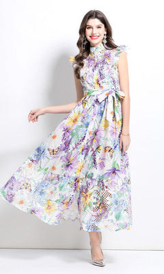 Woman wearing a lavender High-Neck Long Print Casual Dress with cap sleeves, standing against a white background and smiling.