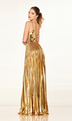 A woman in the Cecilia Couture 2609 gold, floor-length pleated A-line prom dress with an embellished bodice stands with her back slightly turned, looking over her shoulder against a plain light background.
