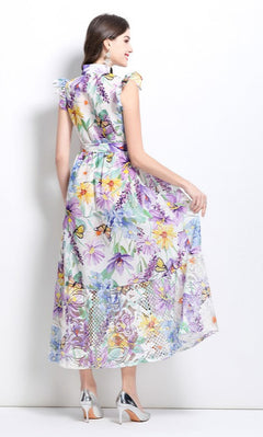 A woman is seen from the back, wearing a High-Neck Long Print Casual Dress with Cap Sleeves and high heels, standing against a plain white background.