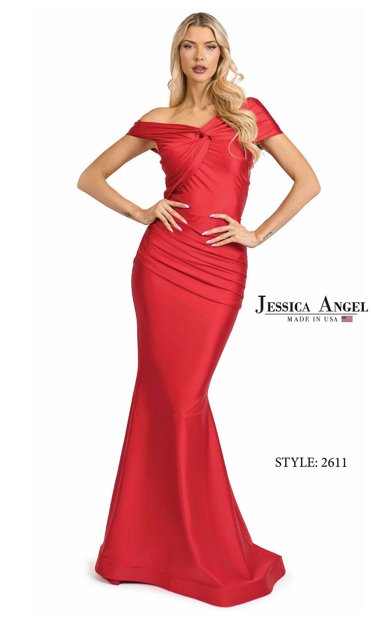 A woman stands with hands on hips in a red Jessica Angel 2611 long prom dress, featuring off-shoulder design, fitted stretch satin-jersey fabric, ruched details, and a flared mermaid hem. Text: 