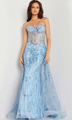 A woman models the Jovani Strapless Long Glitter-Sequin Prom Dress 26113 in light blue, featuring a strapless sheer corset-style bodice and mermaid skirt, standing against a plain background.