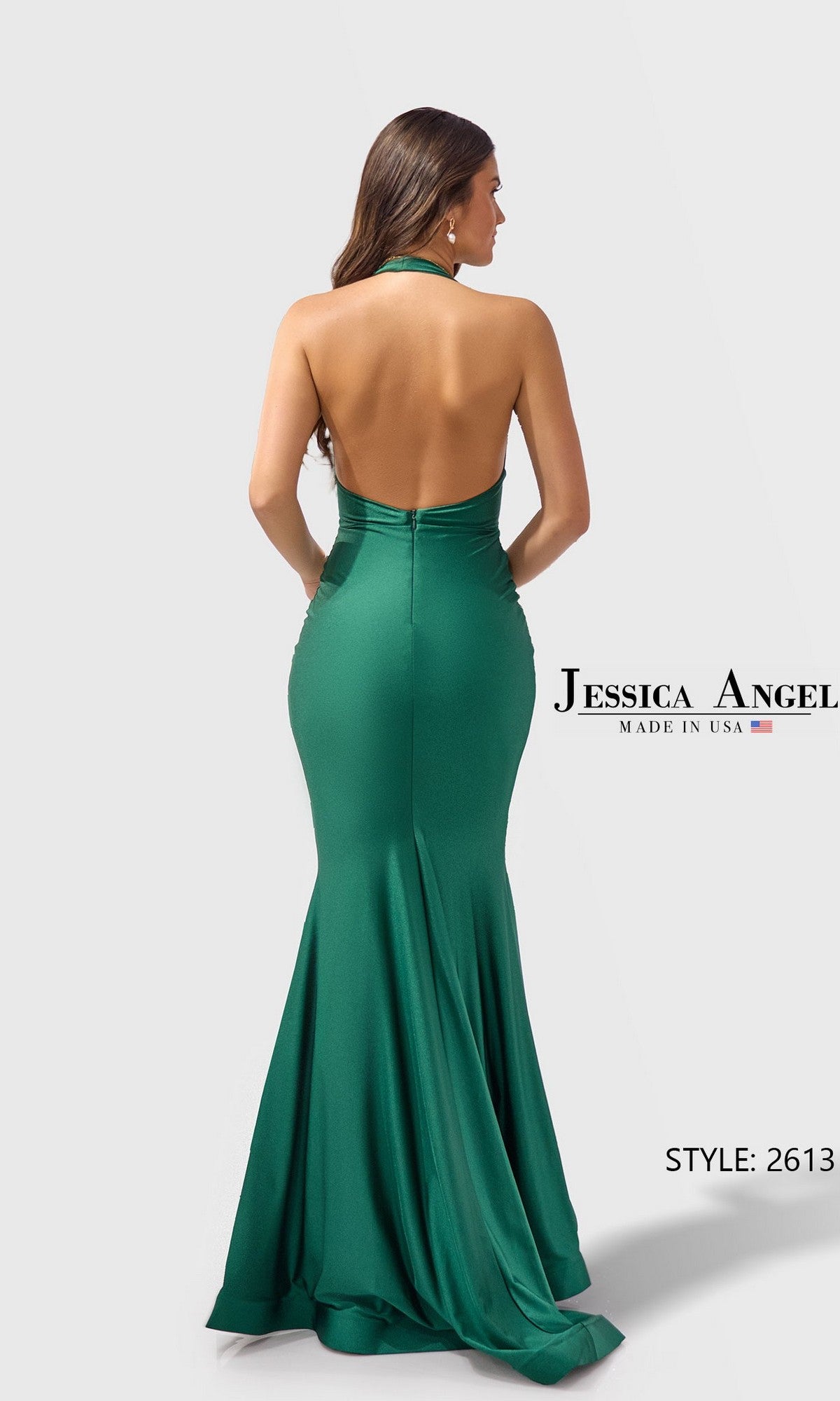 A woman models the Jessica Angel 2613 long prom dress—a green, backless halter in stretch jersey with a mermaid silhouette. Text: 