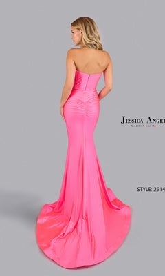 A woman wears the bright pink Strapless Cut-Out Prom Gown: Jessica Angel 2614, a mermaid-style dress with a dramatic train, posing against a plain gray background.