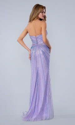 A woman faces away, wearing the Stella Couture 26163 Long Prom Dress—a strapless lavender gown with a fitted silhouette, shimmering vertical stripes, and a floor-length hem.