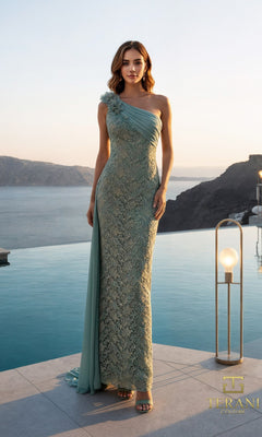 A woman in a sage Long Formal Dress (Terani 261E6257) with one-shoulder lace and 3D floral appliques stands by an infinity pool at sunset, with cliffs and water in the background.