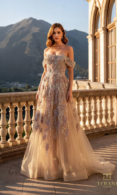 A woman in a nude Long Formal Dress (Terani 261M6435) stands on an elegant stone balcony, with majestic mountains and sky creating a stunning backdrop.