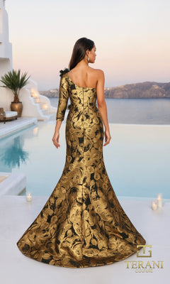 A woman wearing the Terani 261E6275 long formal dress with gold and black floral accents stands by a pool, overlooking a scenic sunset view.